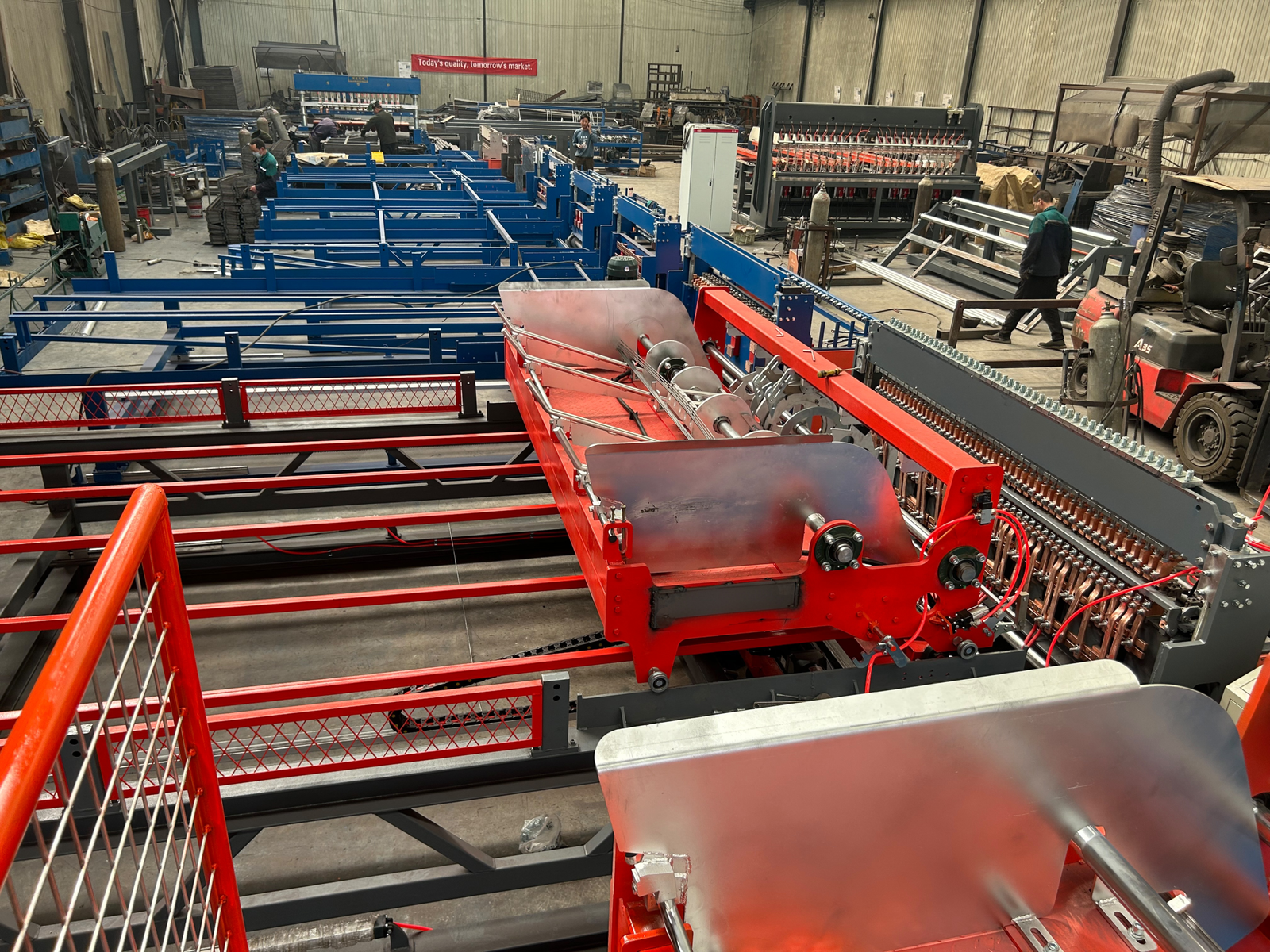 worker-3 Wire mesh welding machine assembly at XINGFEI